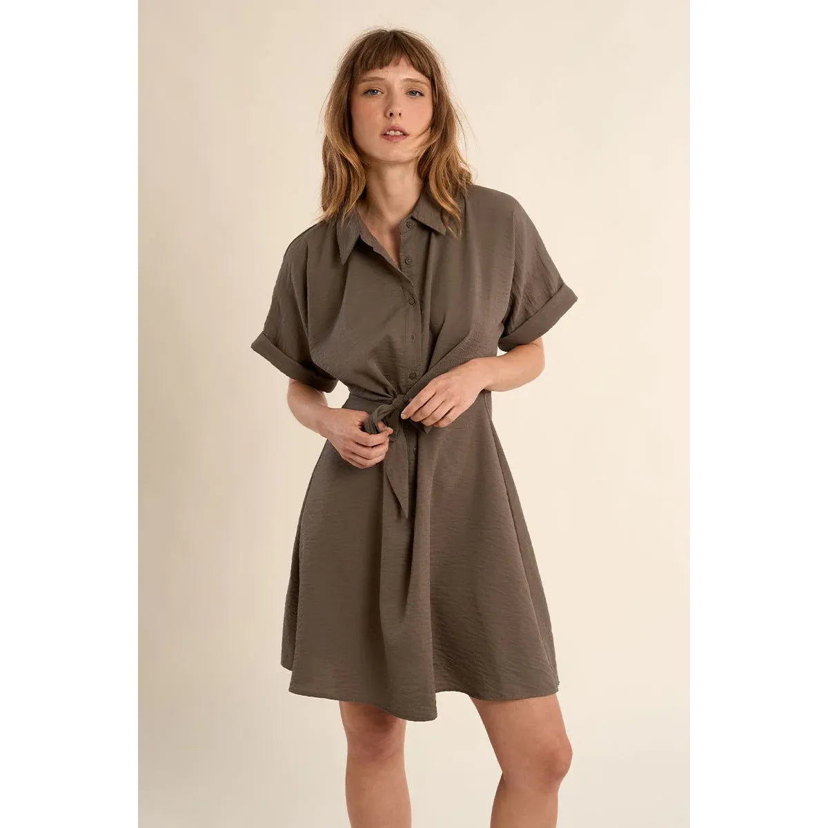 Taupe Molly Bracken short dress with knotted waist, shirt collar, and short sleeves on a model.