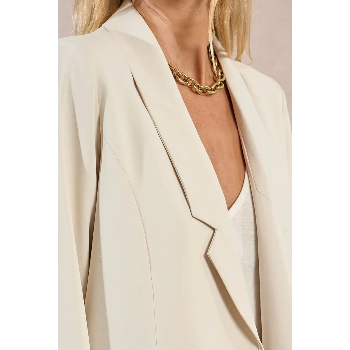 Cream Molly Bracken Straight Blazer with open front and wide lapels, worn over a white top.