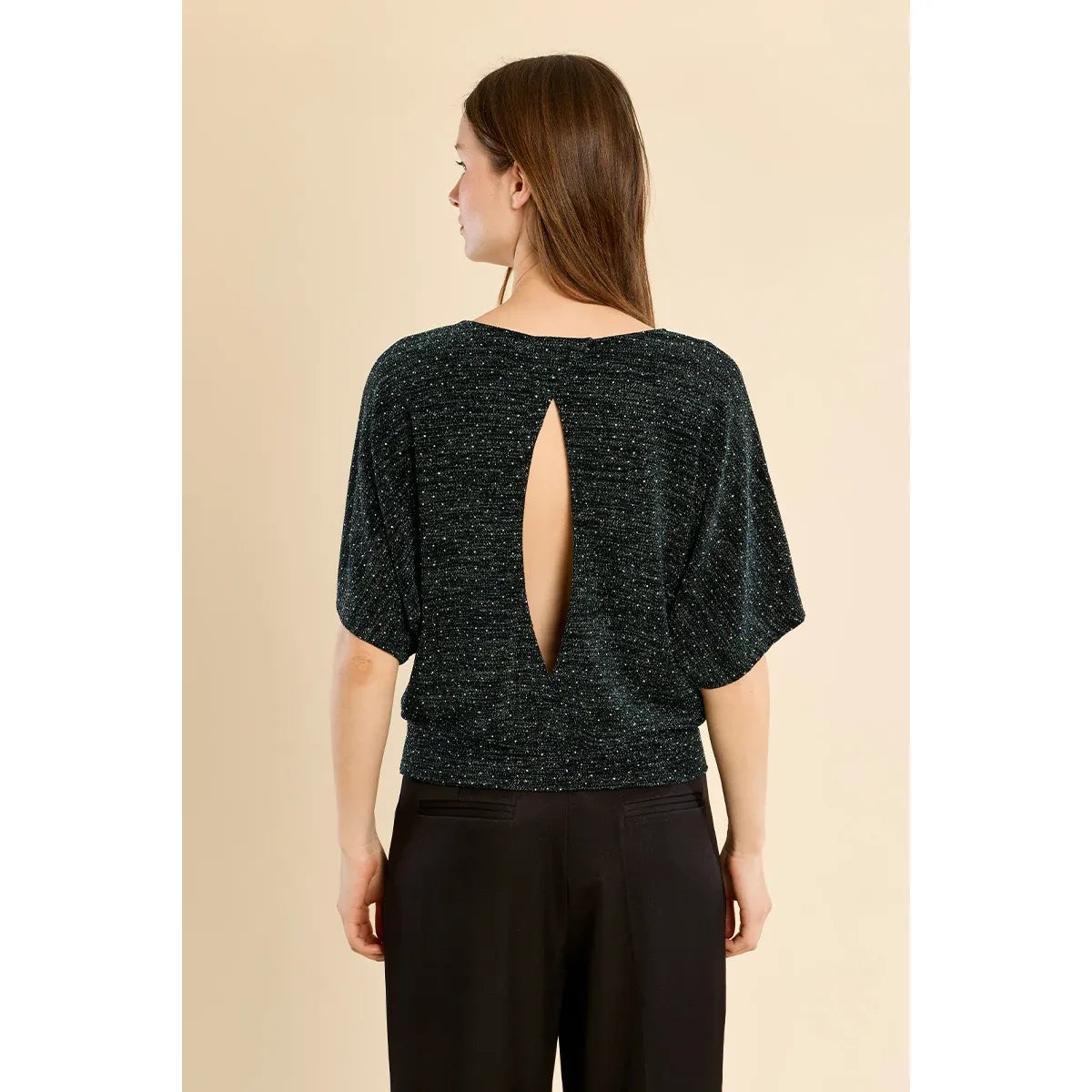 Back view of a dark metallic rhinestone top with wide short sleeves and a vertical keyhole opening at the center of the back.