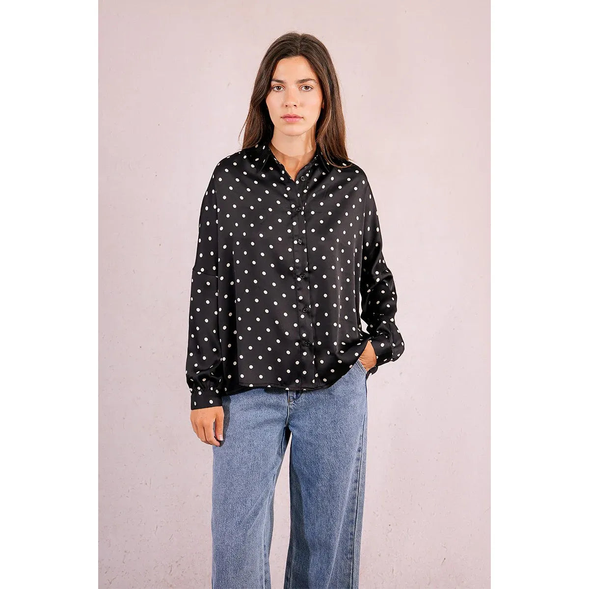 Molly Bracken Polka Dot Blouse in black with white dots, low armholes, long sleeves with buttoned cuffs.