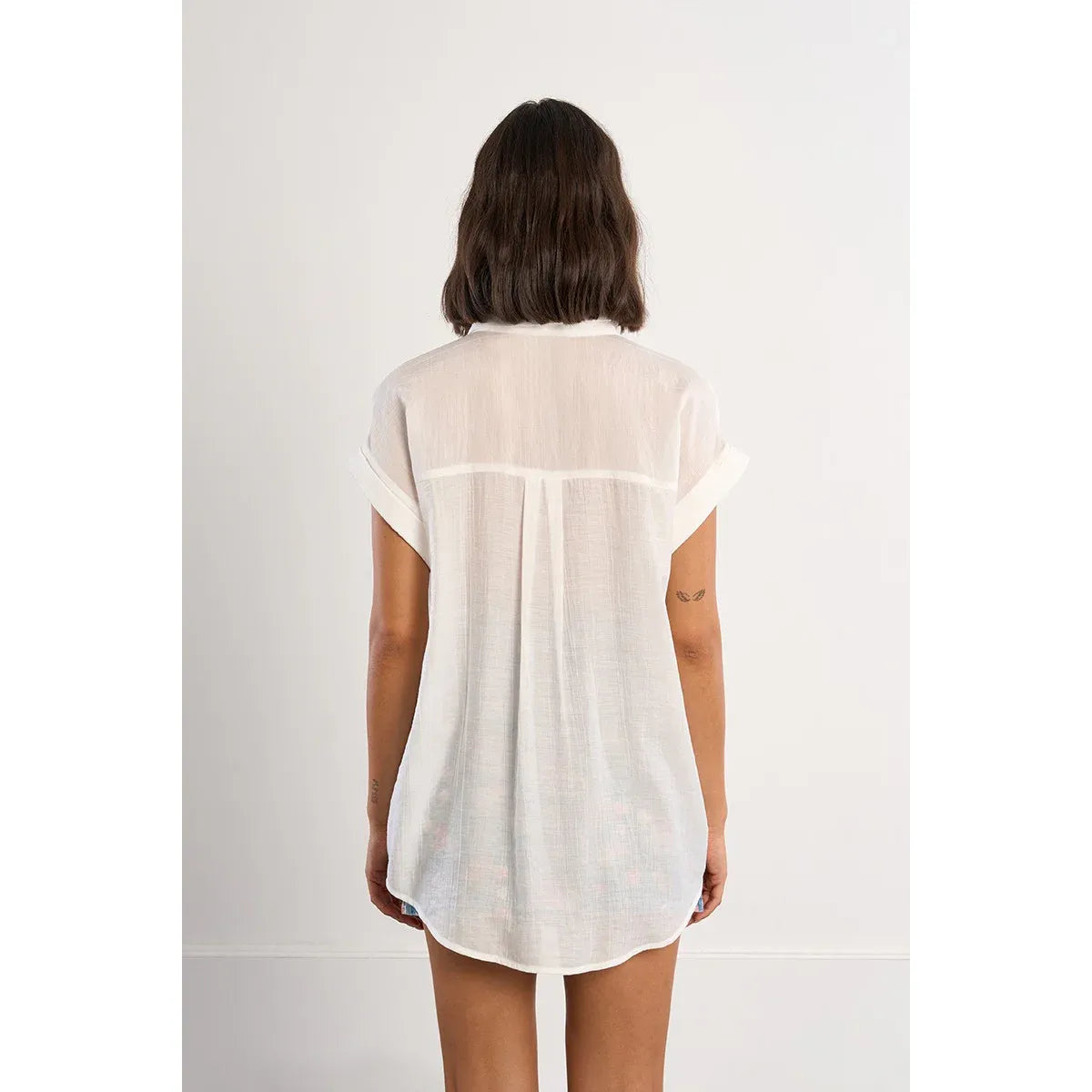 Molly Bracken woven short-sleeve white top, back view with center pleat and draped sheer fit.