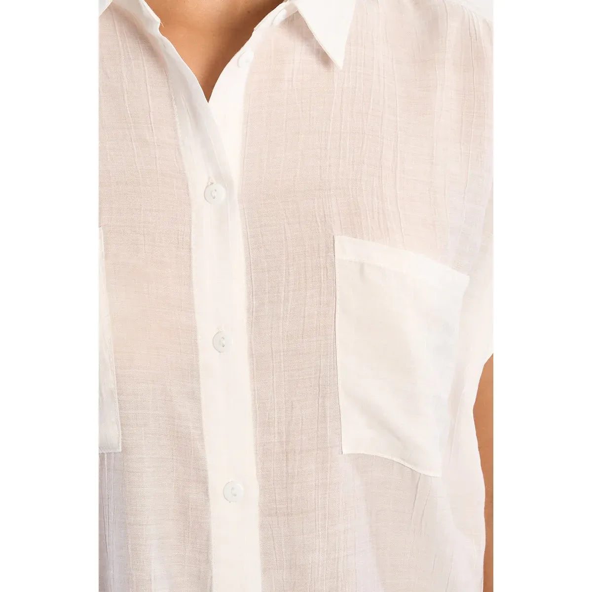 Molly Bracken woven short-sleeve top in white with button placket and chest pocket.