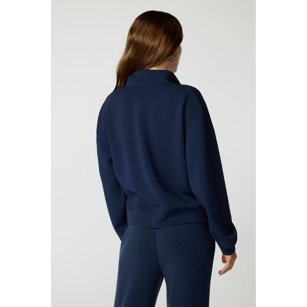 Back view of navy MPG Dreamweave crossover pullover with dropped shoulders and quarter-zip collar.