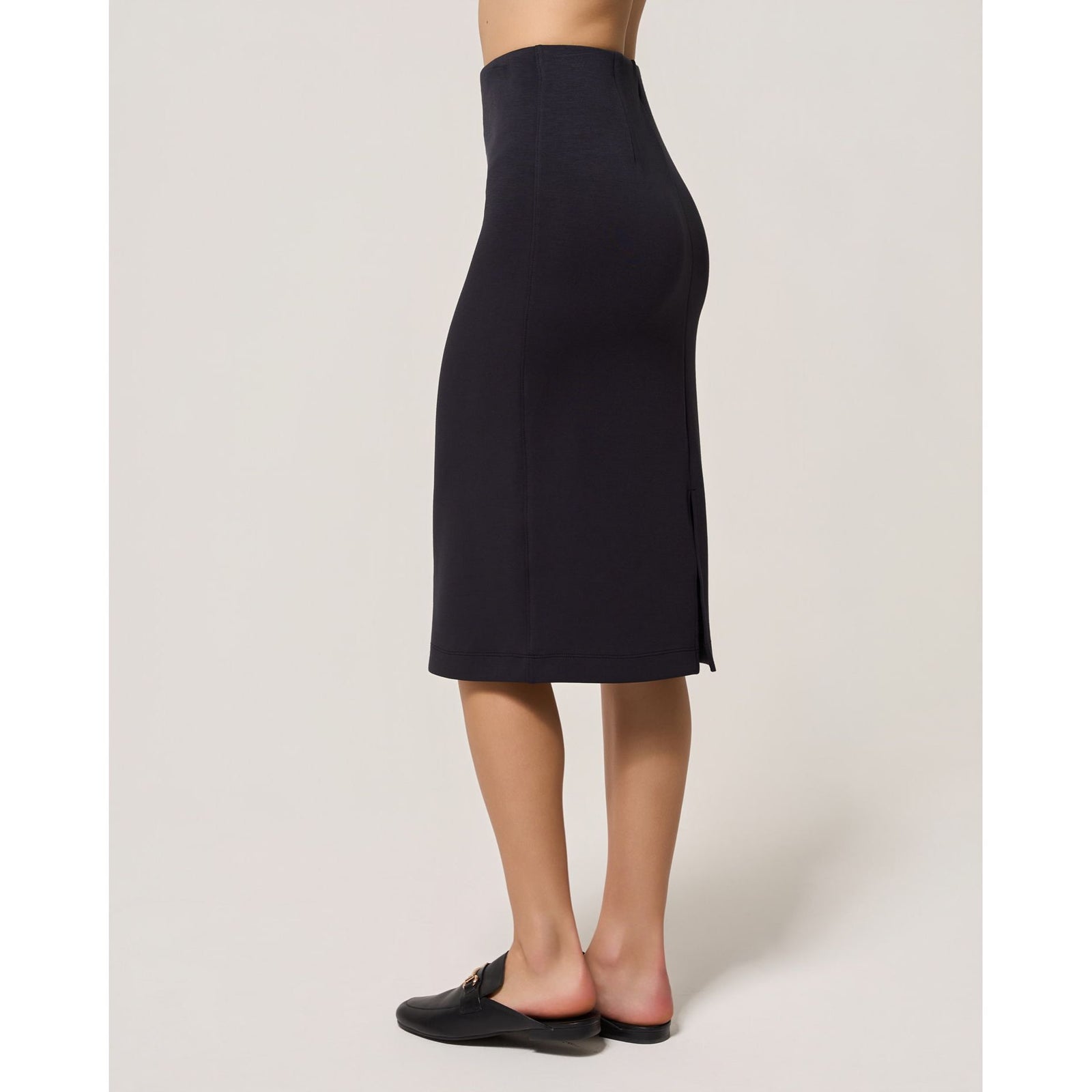 Dark navy Dreamweave pencil skirt featuring a fitted midi silhouette, elasticized waist, and back slit for comfort.