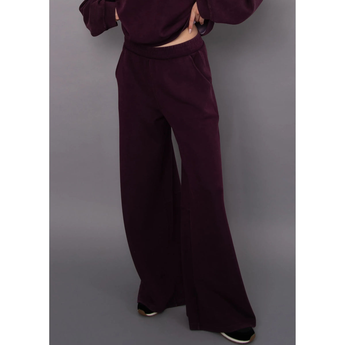 Burgundy wide-leg soft knit pull-on pants with an elastic waistband and side pockets for comfortable, relaxed everyday wear.