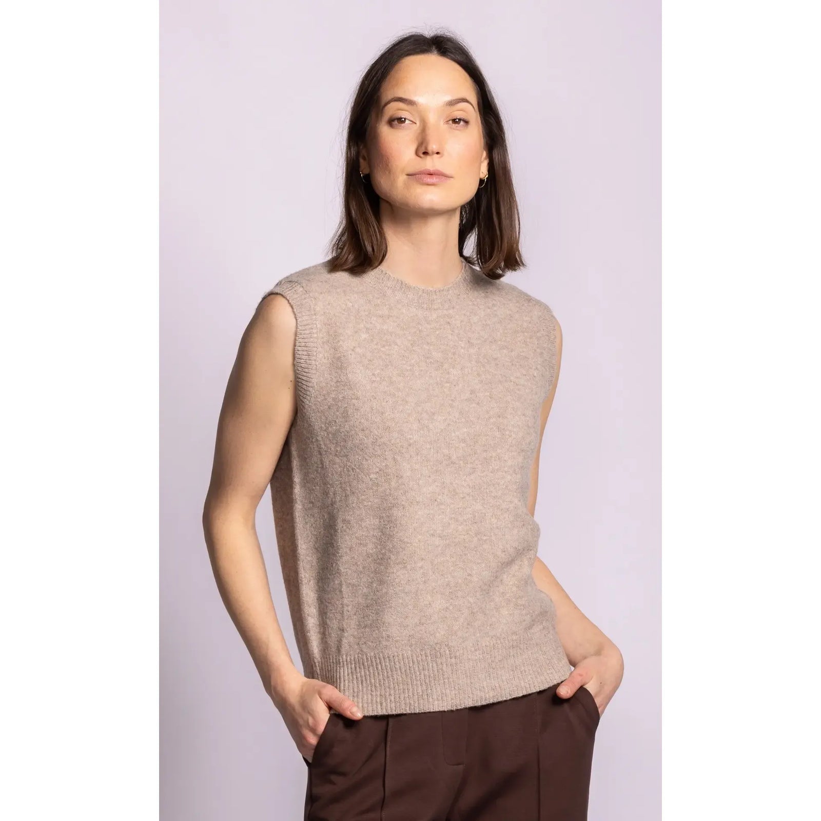 Sleeveless ribbed sweater in a neutral heather tone with structured shoulders and hem, designed for layered elegance.