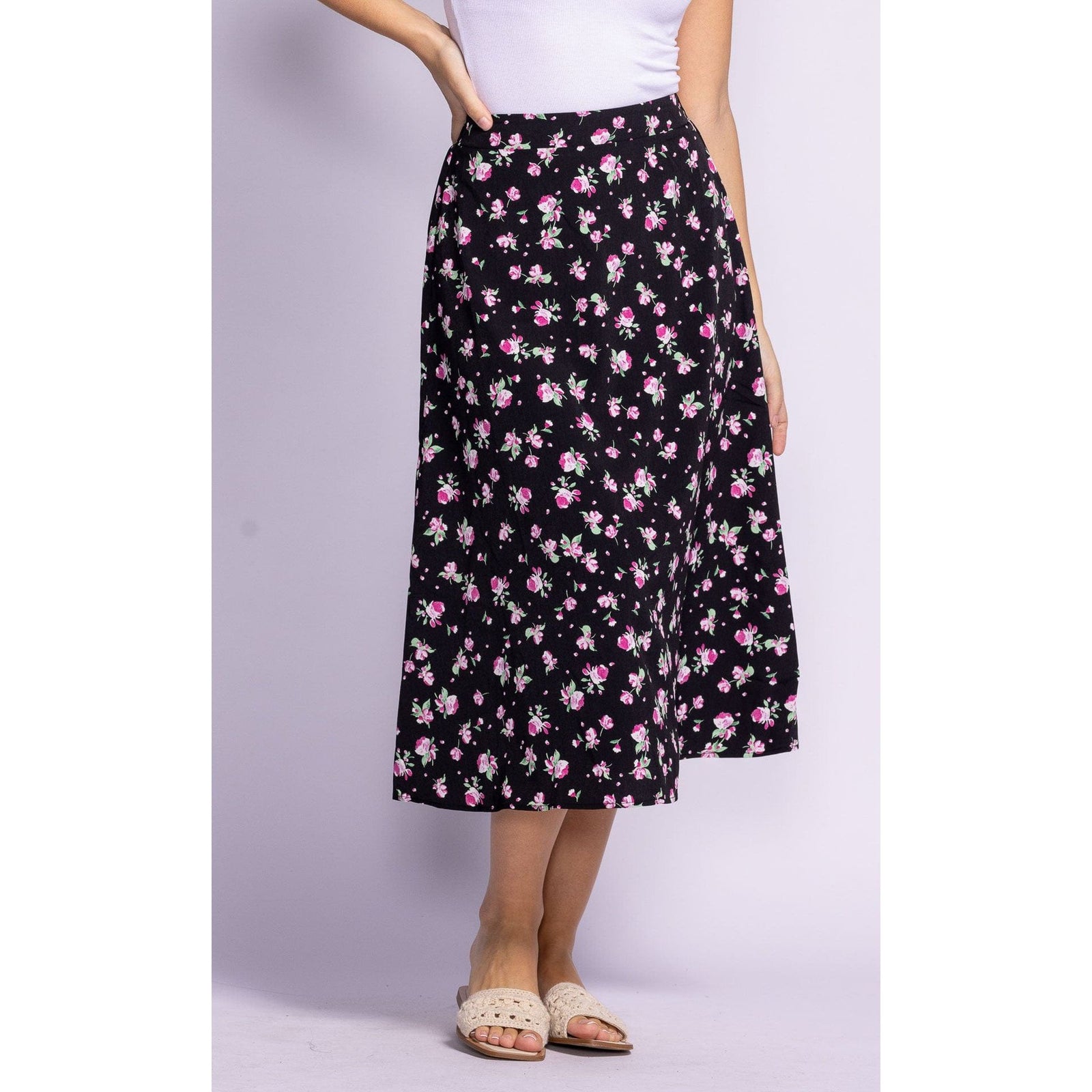 Flaunt your style in the Pink Martini Dolores Skirt, featuring a vibrant floral print, perfect for summer outings.
