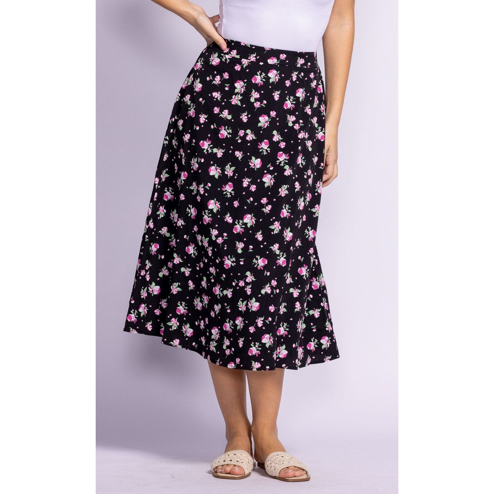 Flaunt your style in the Pink Martini Dolores Skirt, a floral midi perfect for summer days and standout moments.