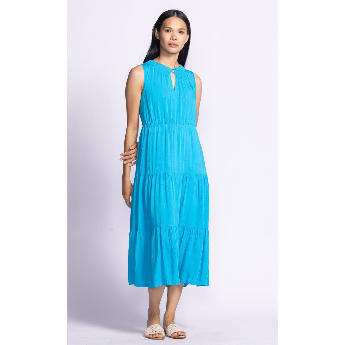 Effortlessly elegant, the Pink Martini Jennifer Dress features a tiered design and elastic waistband for comfort.