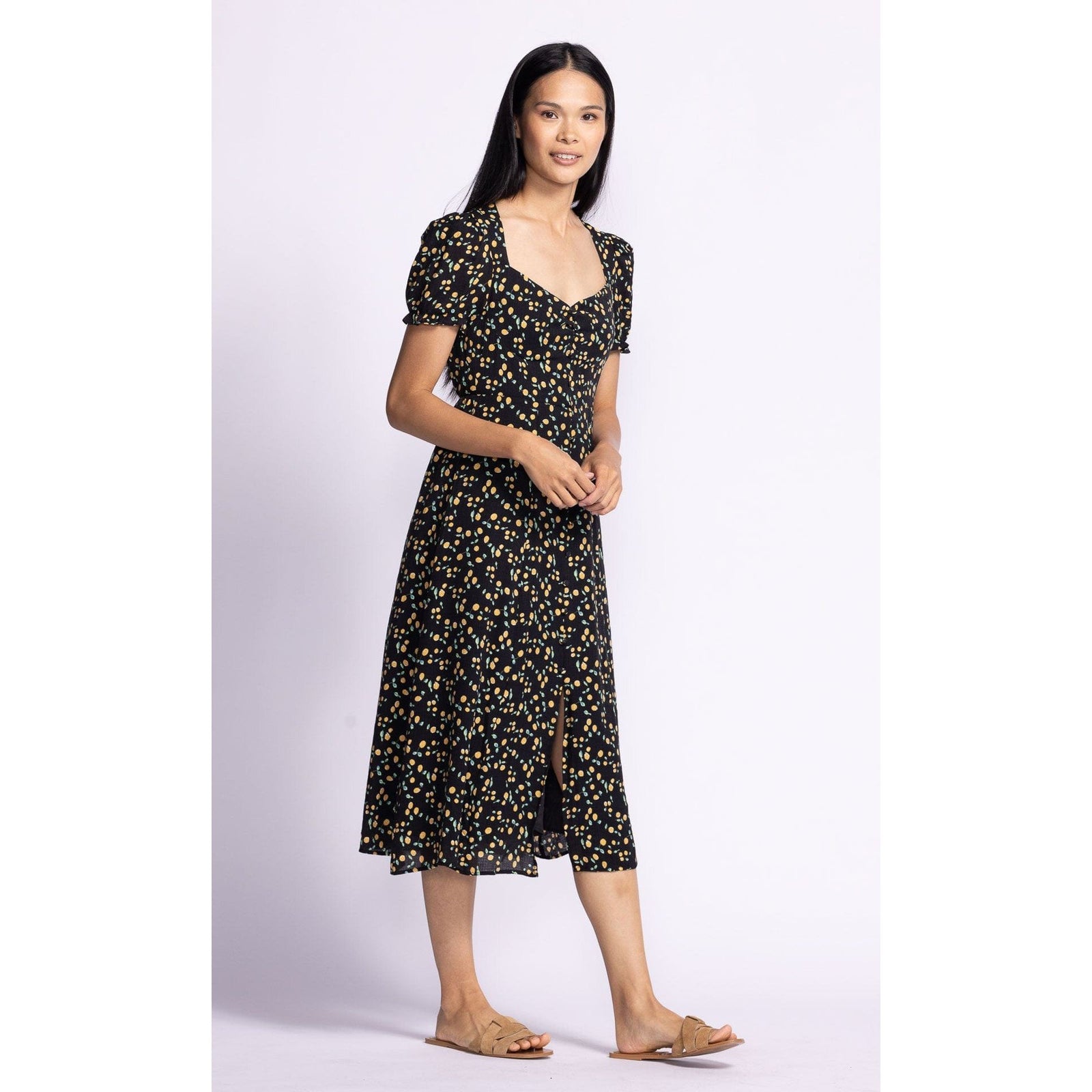 Flatter your figure in the Pink Martini Lala Dress, featuring puff sleeves and a playful design perfect for any occasion.