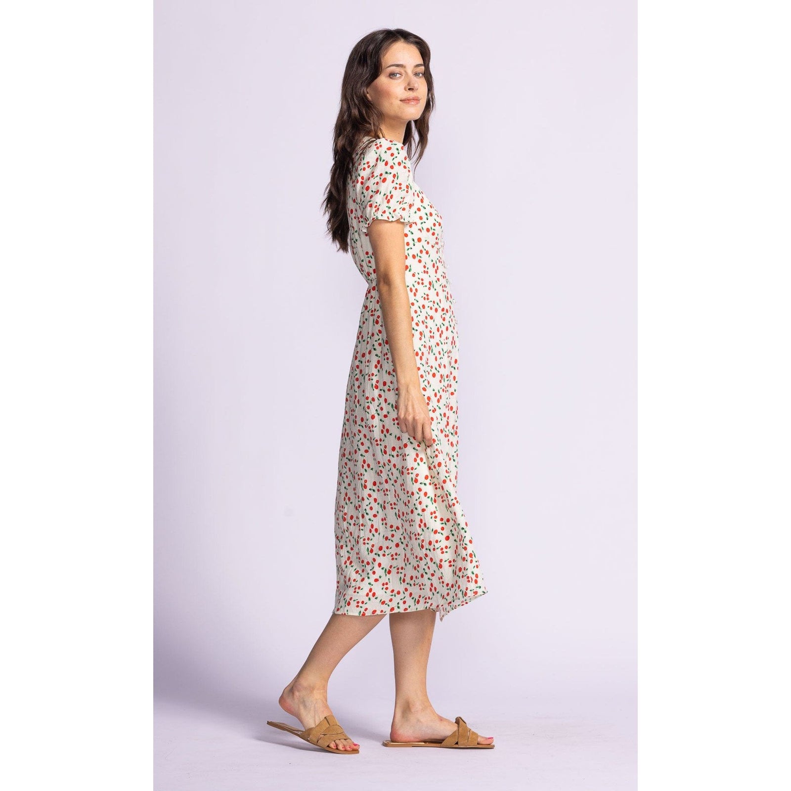 Flirty and fun, the Pink Martini Lala Dress features a sweetheart neckline and puff sleeves for effortless style.