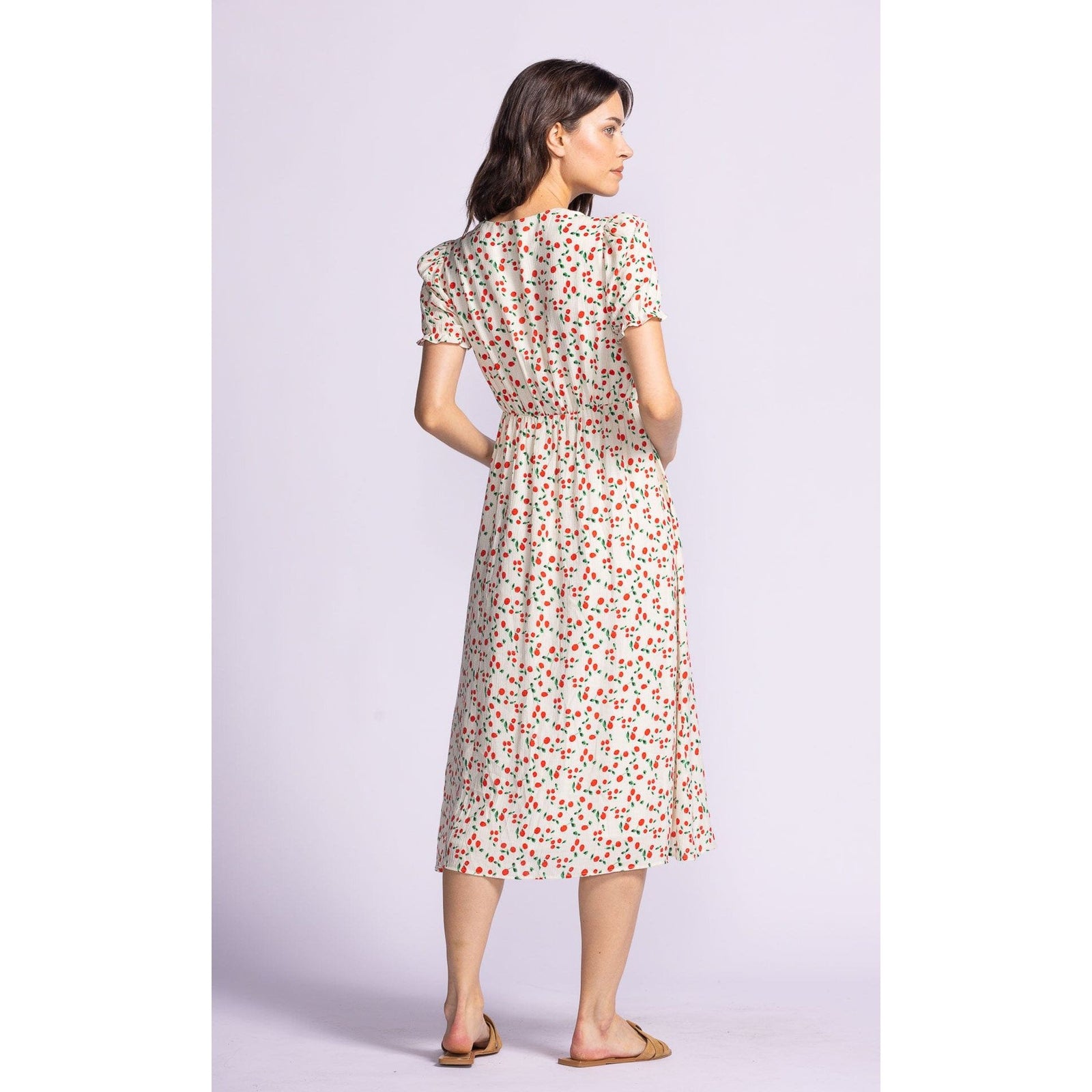 Flirty and stylish, the Pink Martini Lala Dress features puff sleeves and a sweetheart neckline for a chic look.