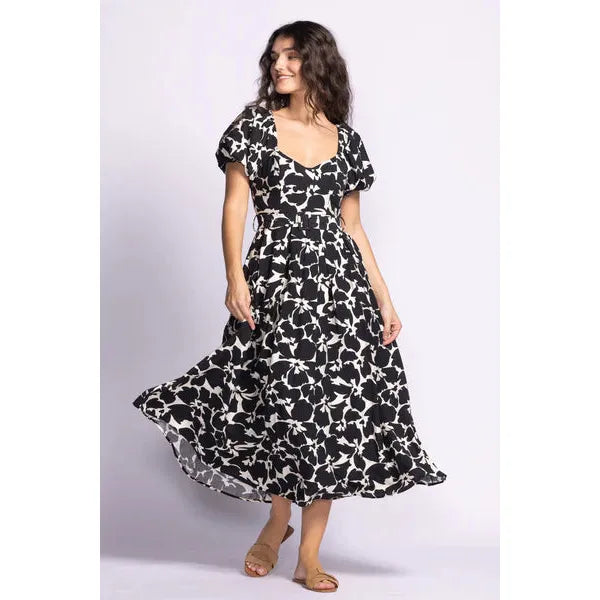 Elegant Pink Martini Rachel Dress featuring puffed sleeves and a floral design, ideal for garden parties.