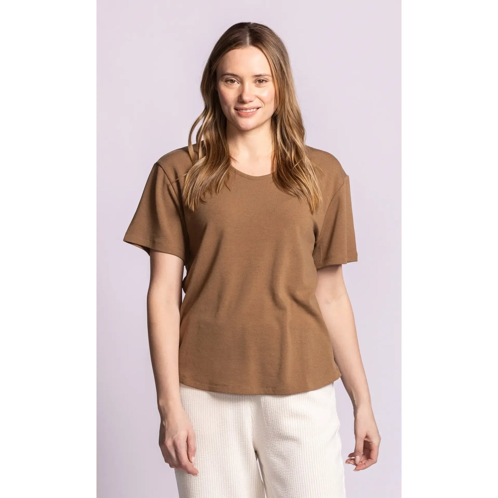 Model wearing a brown Rhiannon Top with a scoop neck and dropped shoulders. A relaxed fit, brushed staple for comfortable layering.