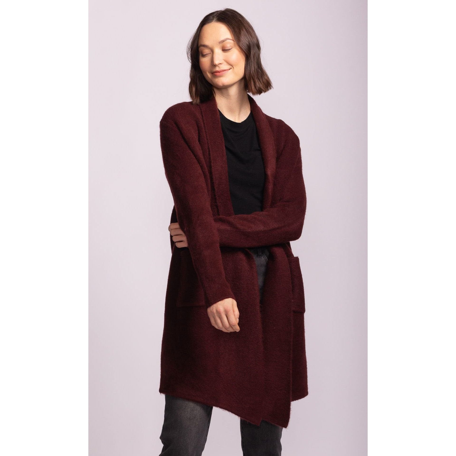Pink Martini Stockport Jacket: burgundy mid-length coat with pockets, worn by a model.