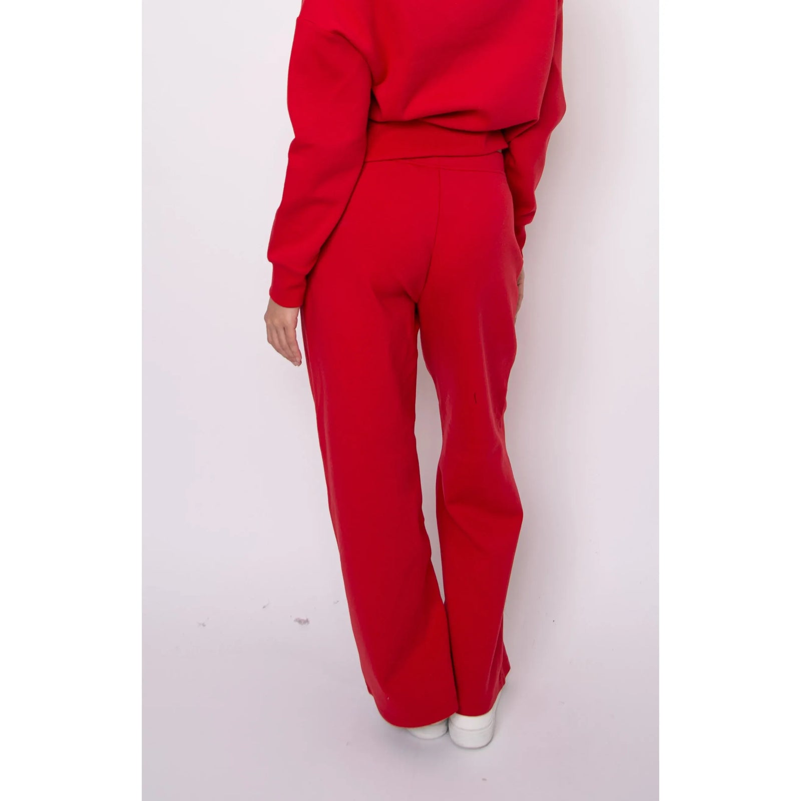 Back view of red Prida soft knit pull-on drawstring-waist pants, relaxed fit with a sleek silhouette.