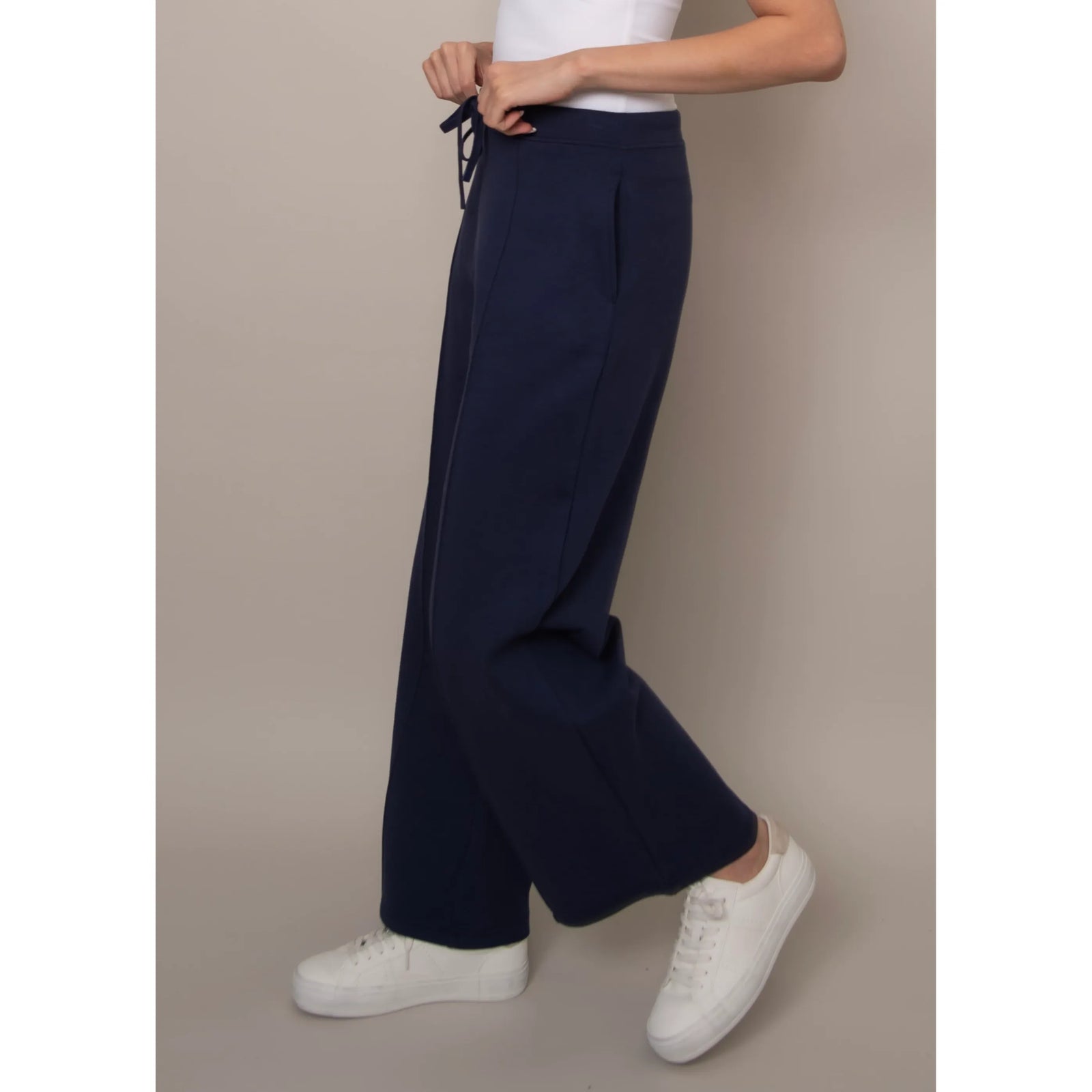Navy Prida Soft Knit Pull-On Drawstring Pant on a model with white sneakers.