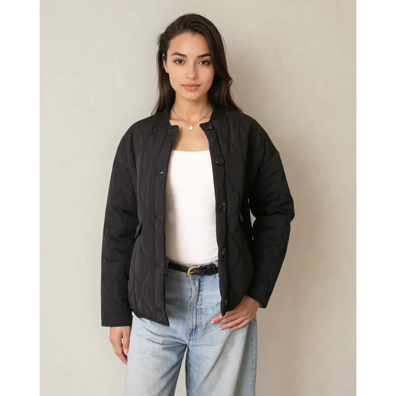 Model wearing Priv Elora Quilted Coat in black with hidden leopard lining and lightweight warmth.