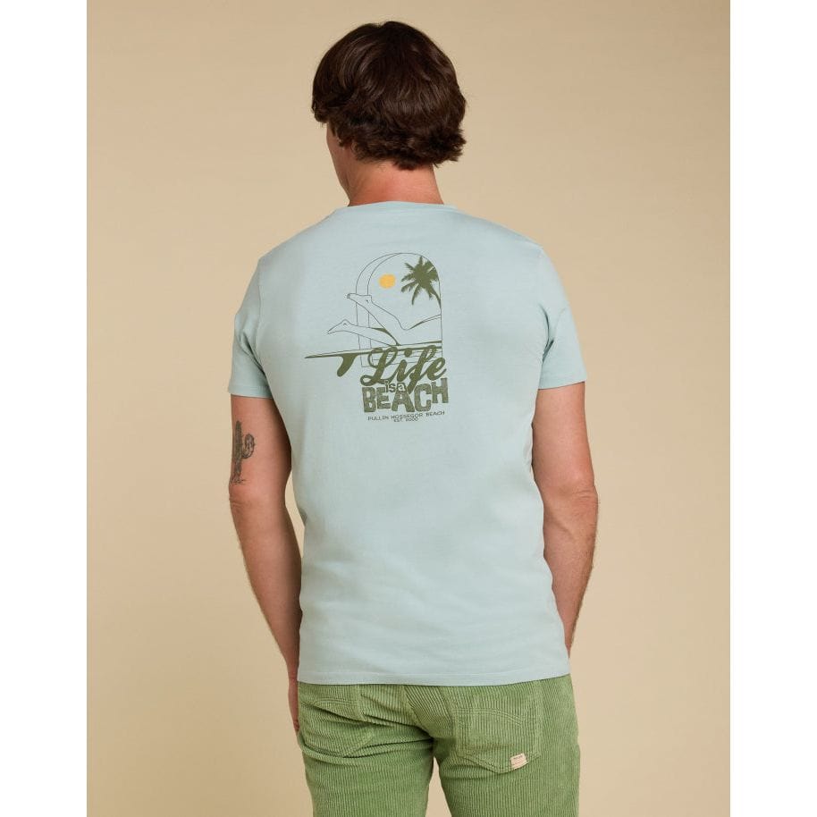 Light blue Pullin Life Tee featuring a beach graphic, made from 100% cotton with a ribbed crew neck. Perfect fit!