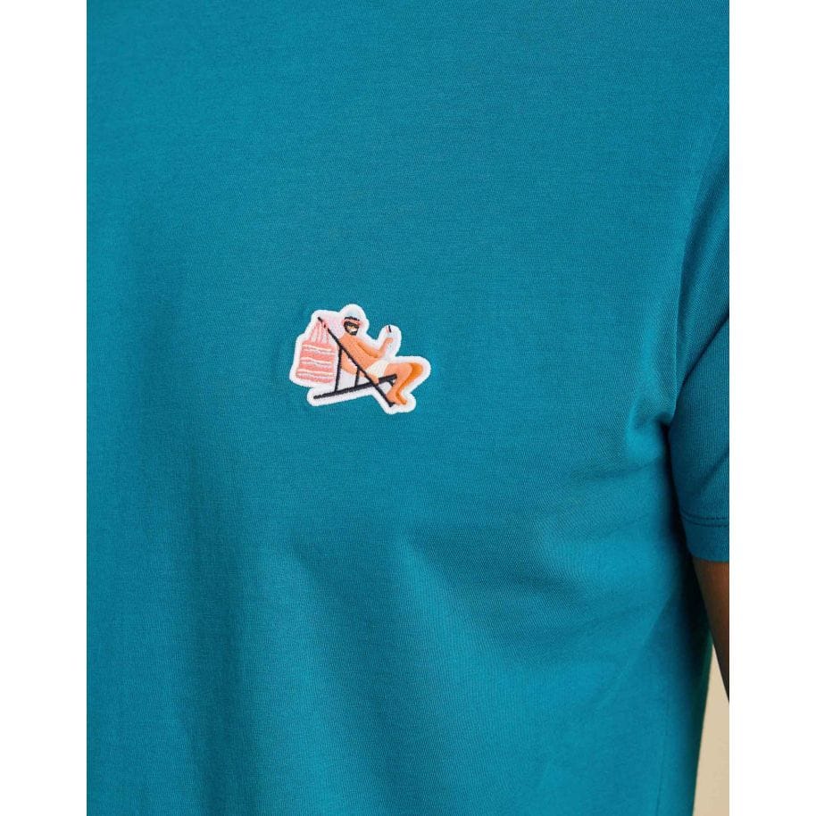 Pullin PatchApero Tee showcases a stylish patch on a vibrant blue cotton t-shirt, perfect for casual wear.
