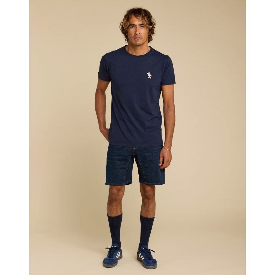 Stylish Pullin PatchSurfeuse Tee in navy, featuring a ribbed crew neck and short sleeves, perfect for casual wear.