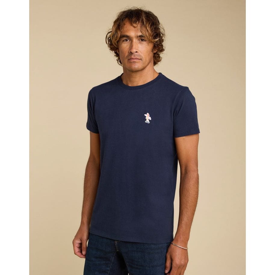 Navy Pullin PatchSurfeuse Tee features a ribbed crew neck and short sleeves, perfect for a stylish casual look.