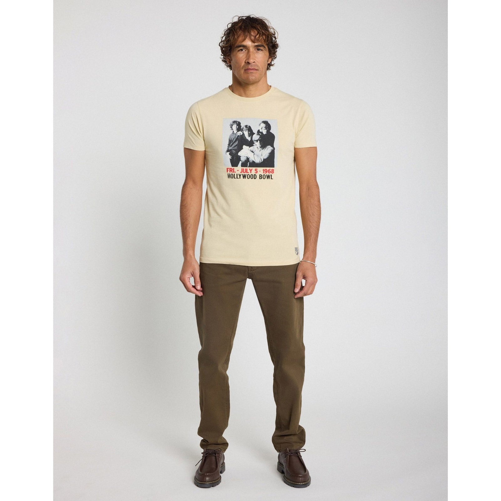 Boldly showcase your style with the Pullin Porte Tee, celebrating The Doors' epic 1968 Hollywood Bowl concert.