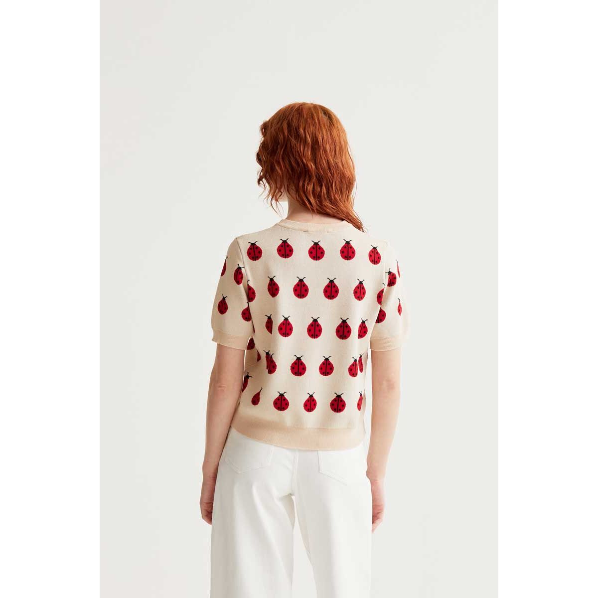 Back view of beige Red Coccinelle Print Tee with repeating red ladybug motif.
