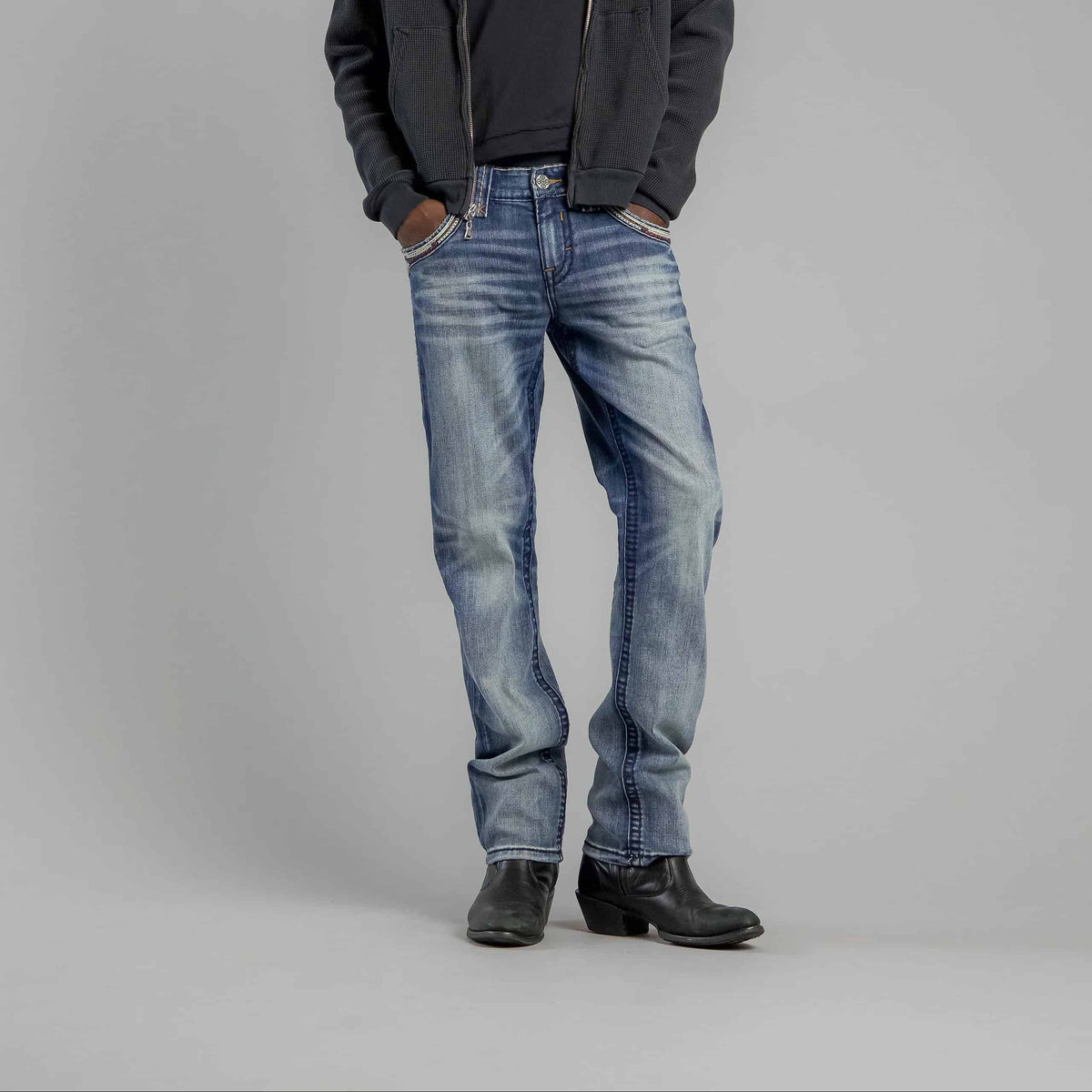 Rock Revival Bexton J202 Straight Denim jeans in a hand-sanded vintage blue wash with Fleur-de-Lis embroidery.