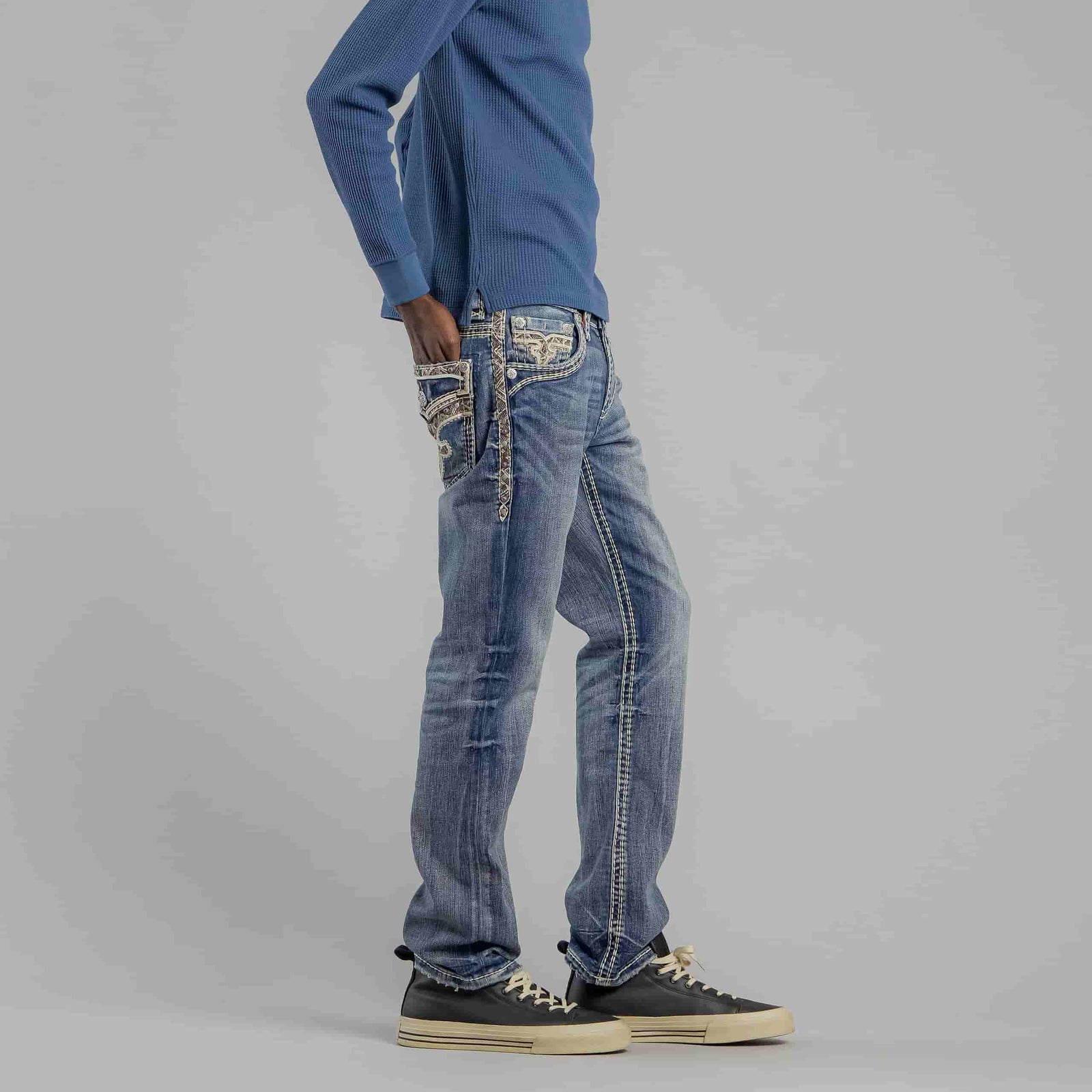 Rock Revival Brayen J246 Straight jeans on model with ornate embroidered back pockets and side strap detail.