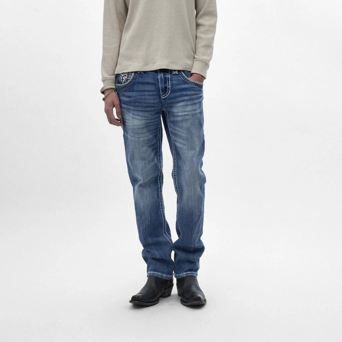 Rock Revival Caleb J200 straight-leg jeans in indigo with subtle fading, contrast stitching, and embroidered back pockets.