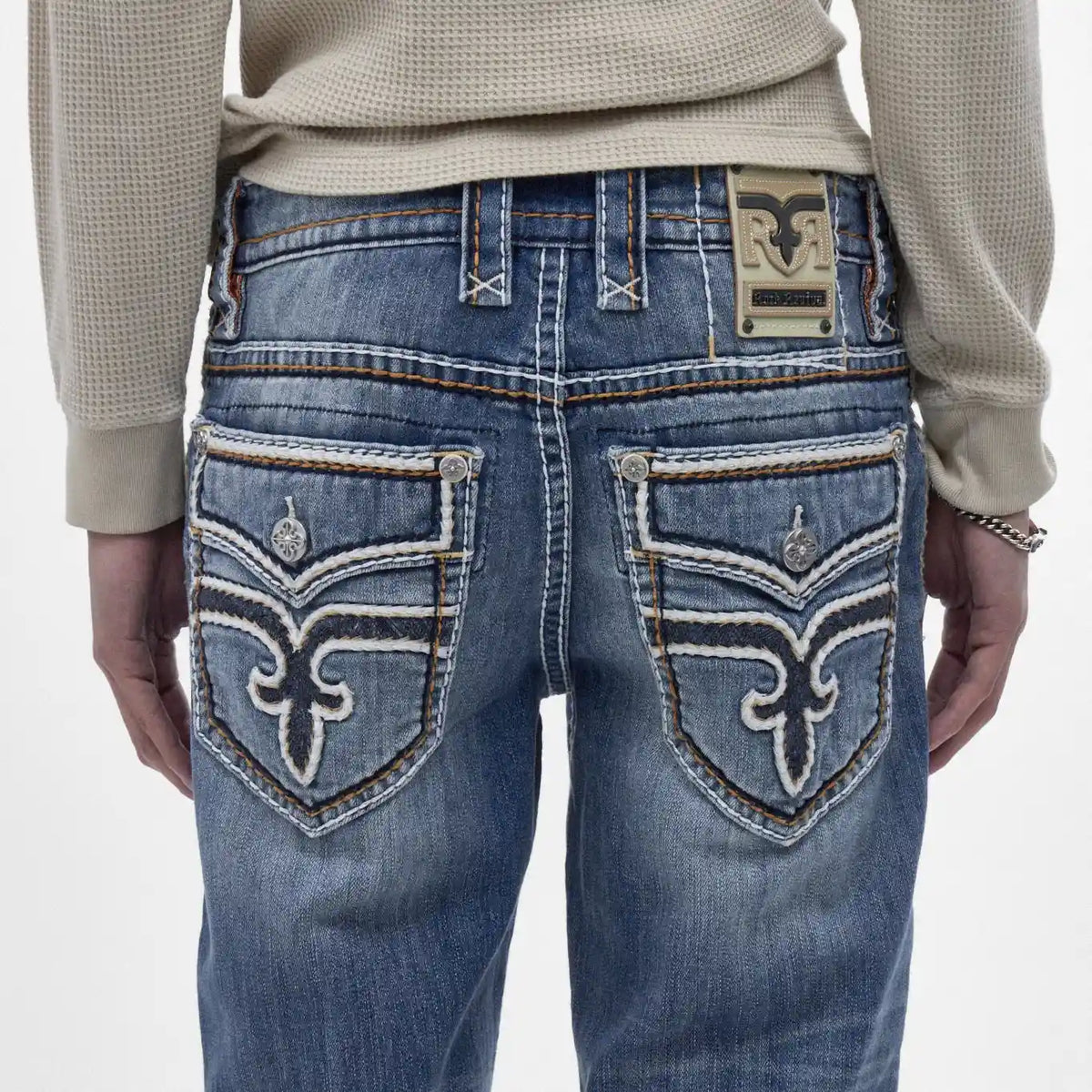 Back view of Rock Revival Caleb J200 straight jeans featuring indigo wash, signature back pocket embroidery, and leather patch.