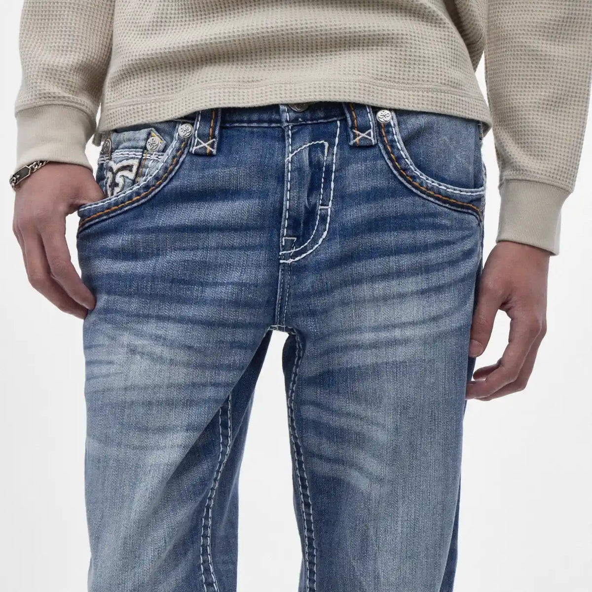 Rock Revival Caleb J200 straight jeans featuring indigo wash, horizontal fading, contrast stitching, and embroidered back pocket detail.