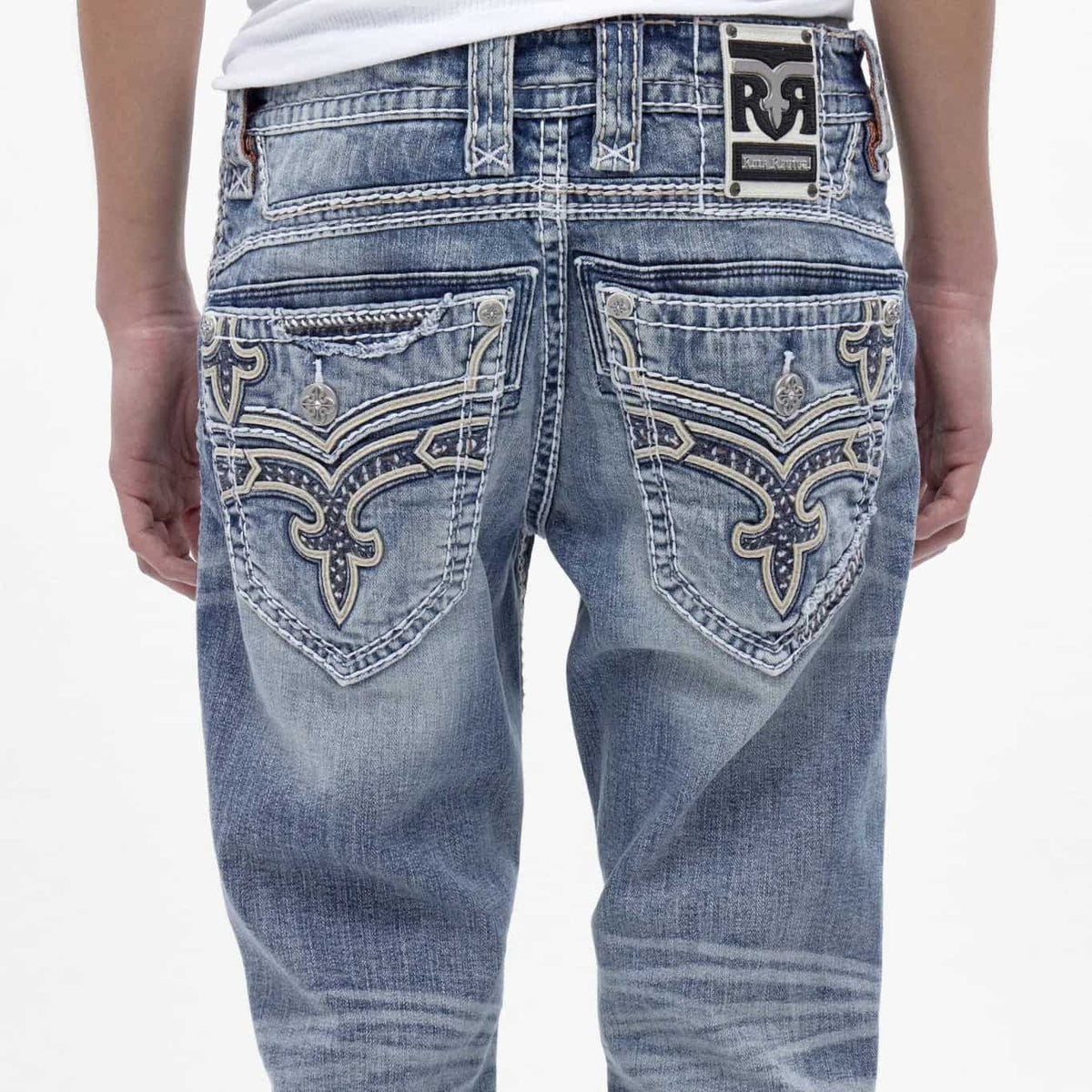 Back view of Rock Revival Flynn B205 bootcut jeans featuring medium blue wash and signature inverted fleur embroidery on rear pockets.