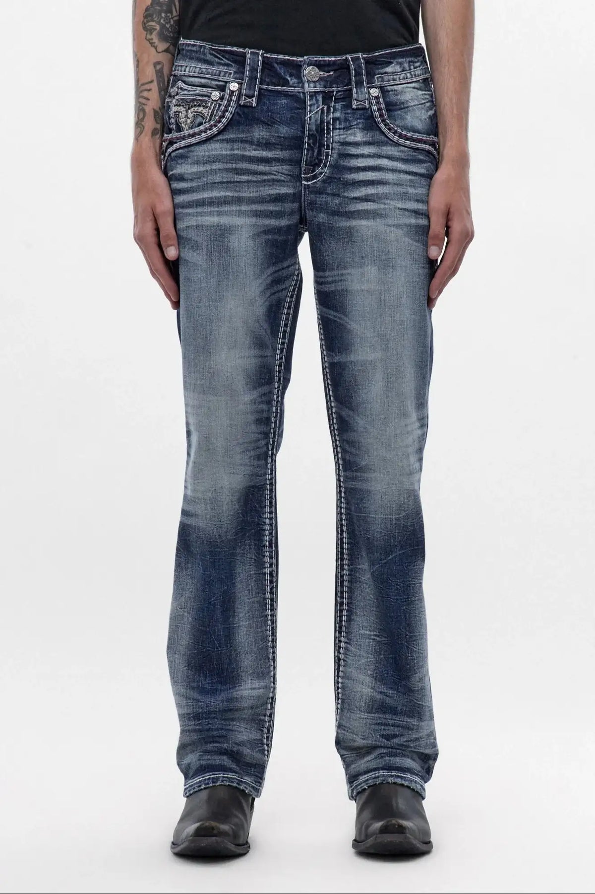 Men's medium blue wash bootcut jeans with signature front pocket embroidery and distressed detailing.
