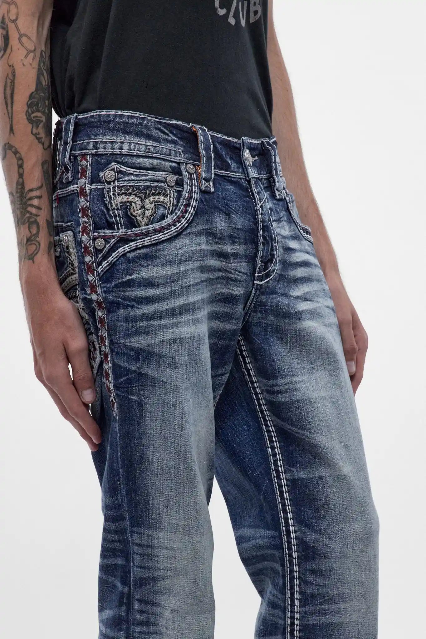 Rock Revival Ozzy B203 bootcut jeans in medium blue with signature back pocket embroidery and contrast side stitching.