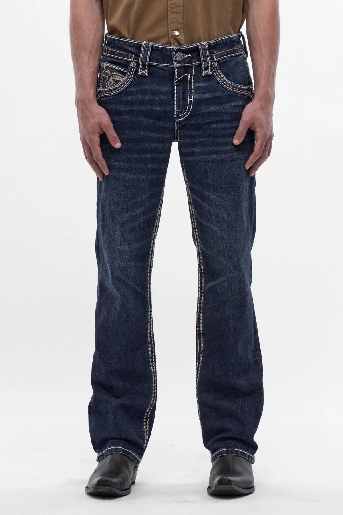 Men's dark blue bootcut jeans with fleur-de-lis embroidery and contrast stitching. Polished washed denim fit.