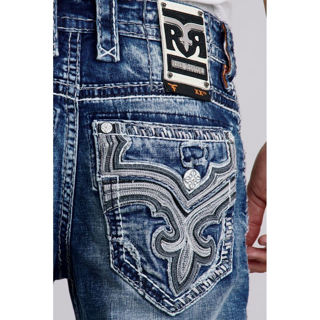 Rock Revival Waylon B200 Bootcut jeans with intricate white embroidery on back pocket, medium indigo denim, RR patch.