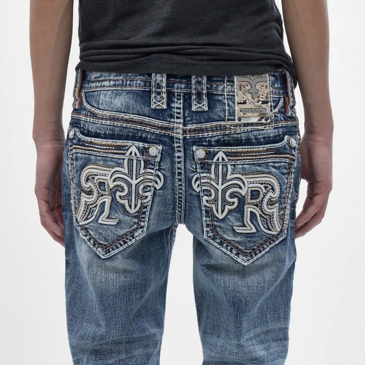 Back view of Rock Revival Zayn J200 straight jeans featuring distinct fleur-de-lis and RR embroidery on pockets with a washed indigo finish.
