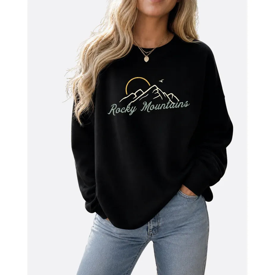 Rocky Mountains Cozy Crew black sweatshirt with mountain silhouette and script logo.