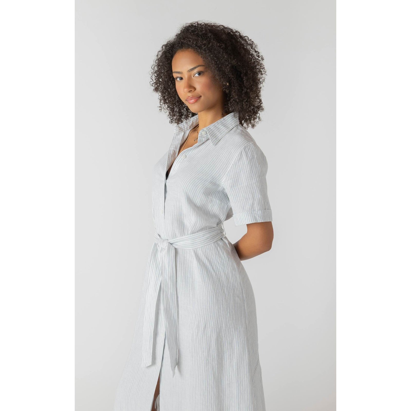 Room 34 Belted Shirtdress in light blue striped fabric with waist tie and short cuffed sleeves.