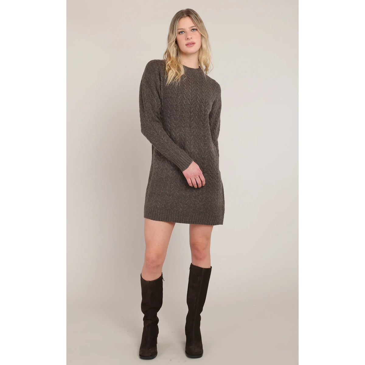 Chestnut Heather cable knit mini dress with long sleeves and a crew neck, styled with dark brown suede boots.