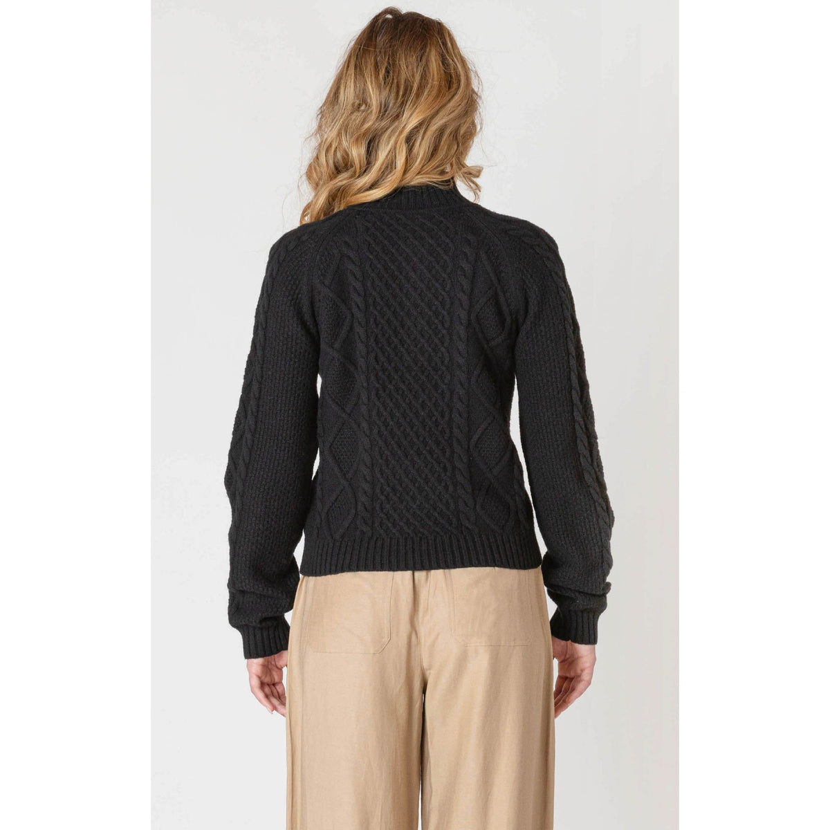 Back view of black Room 34 half-zip cable-knit sweater with ribbed hem and cuffs.