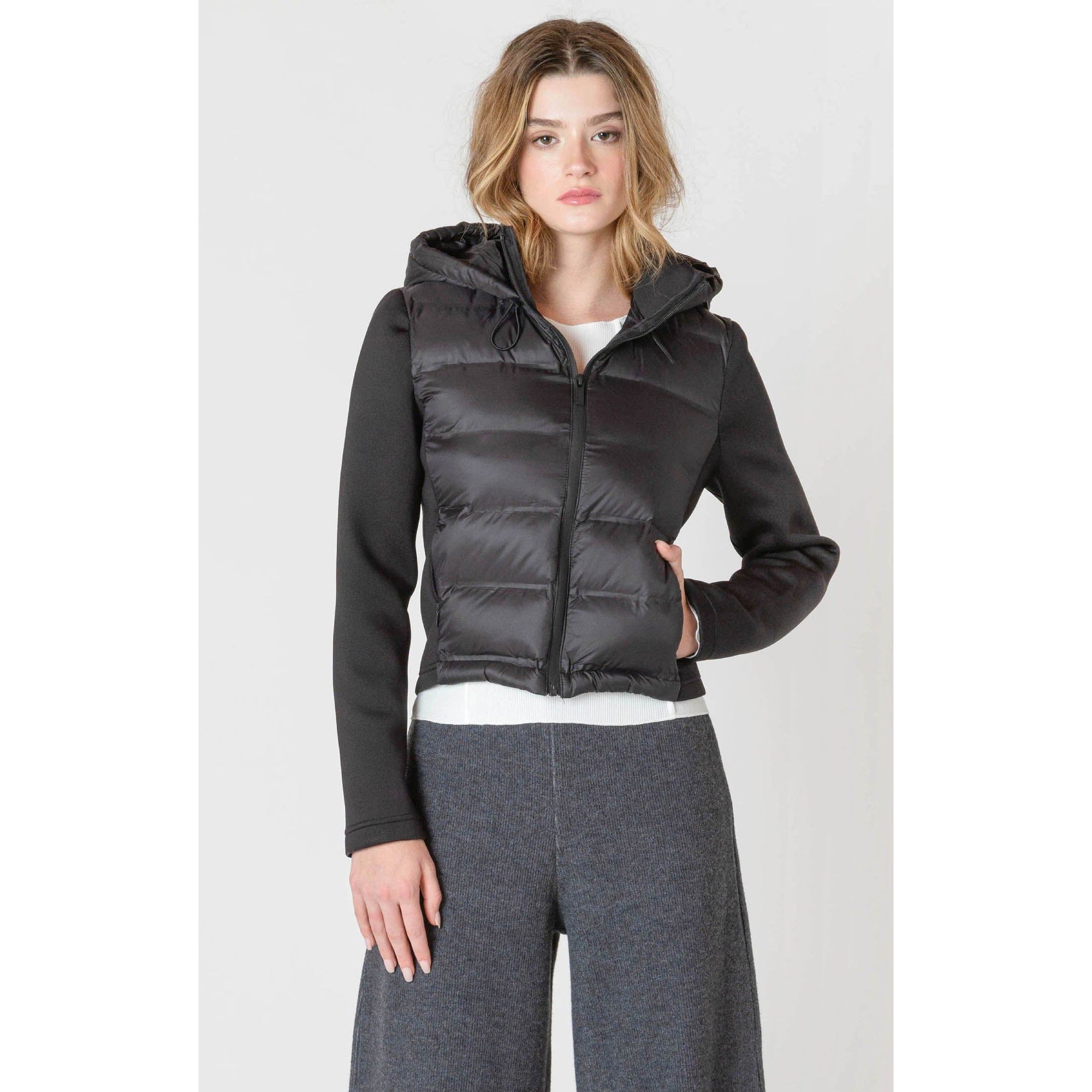 Stylish and cozy, the Room 34 Hooded Puffer Vest features a quilted design perfect for autumn layering.