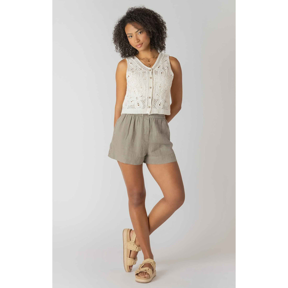 Room 34 Mid-Rise Shorts worn by a model in a cream crochet top; warm-weather casual look.