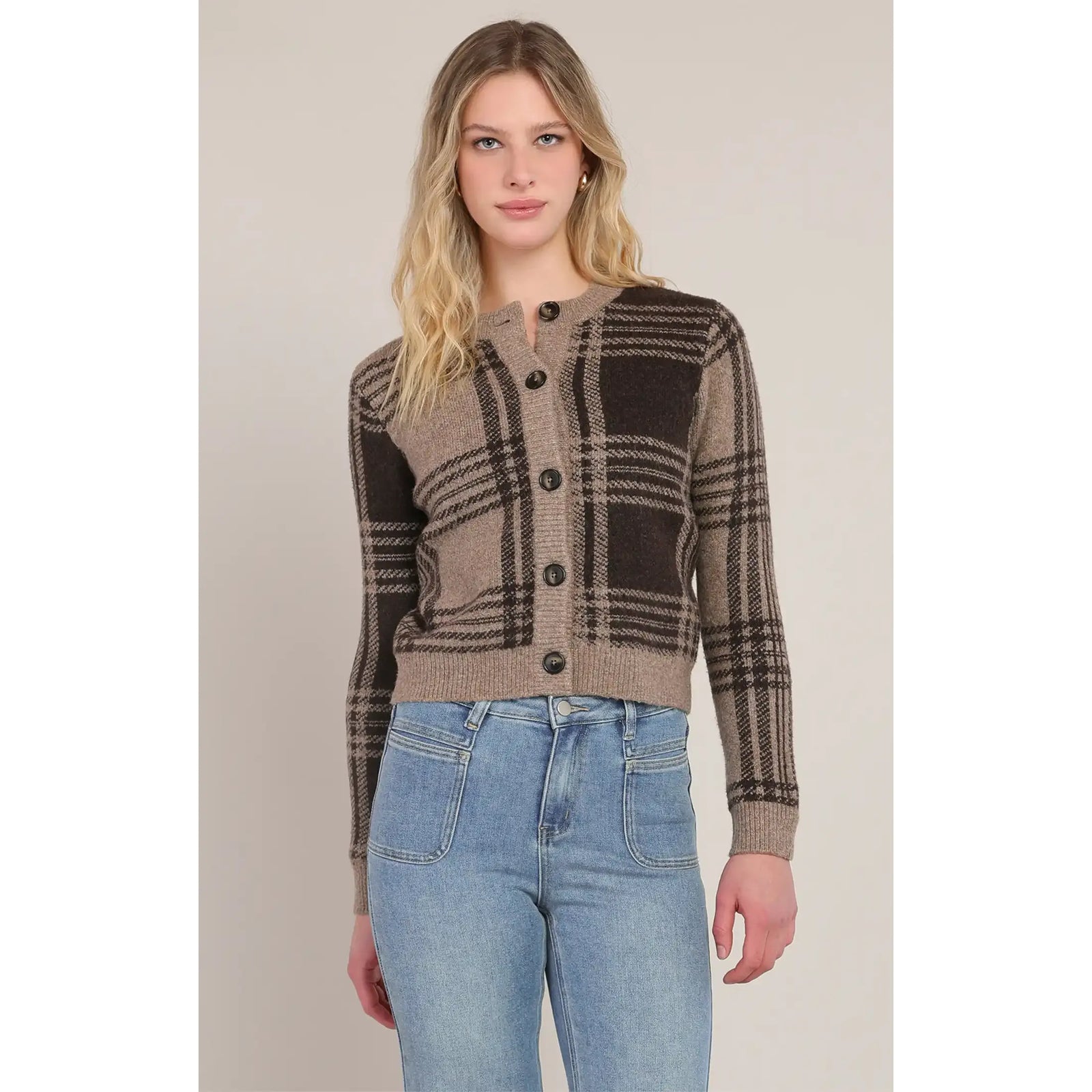 Taupe-brown plaid cardigan with black buttons and stretch knit, styled with blue jeans for a versatile everyday look.