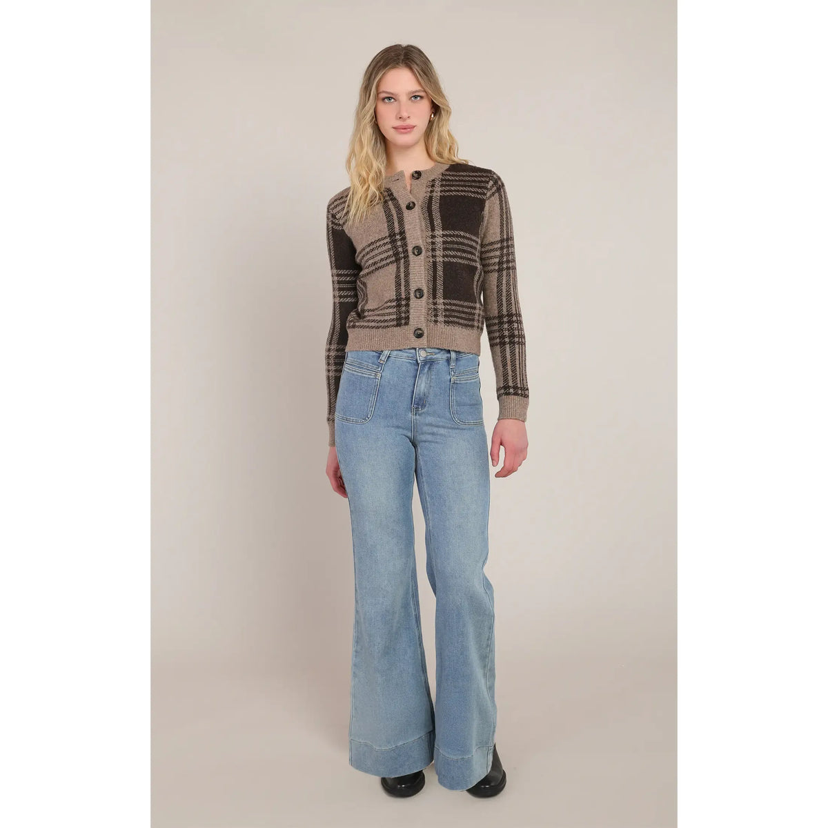 Taupe and brown plaid button-down cardigan paired with light wash flare jeans for a cozy everyday layer.