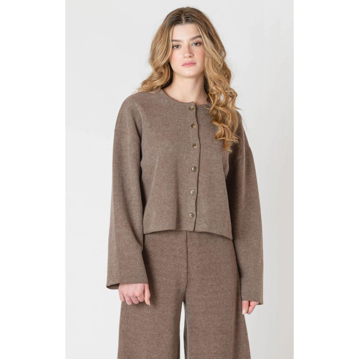 Cozy up in the Room 34 Ribbed Cardigan, featuring long sleeves and a soft ribbed texture for fall days.