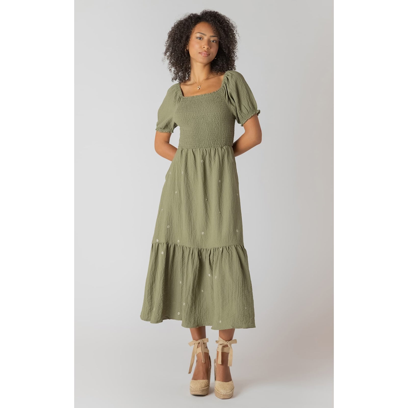 Room 34 smocked tiered maxi dress in olive green with puff sleeves and delicate embroidered flowers.