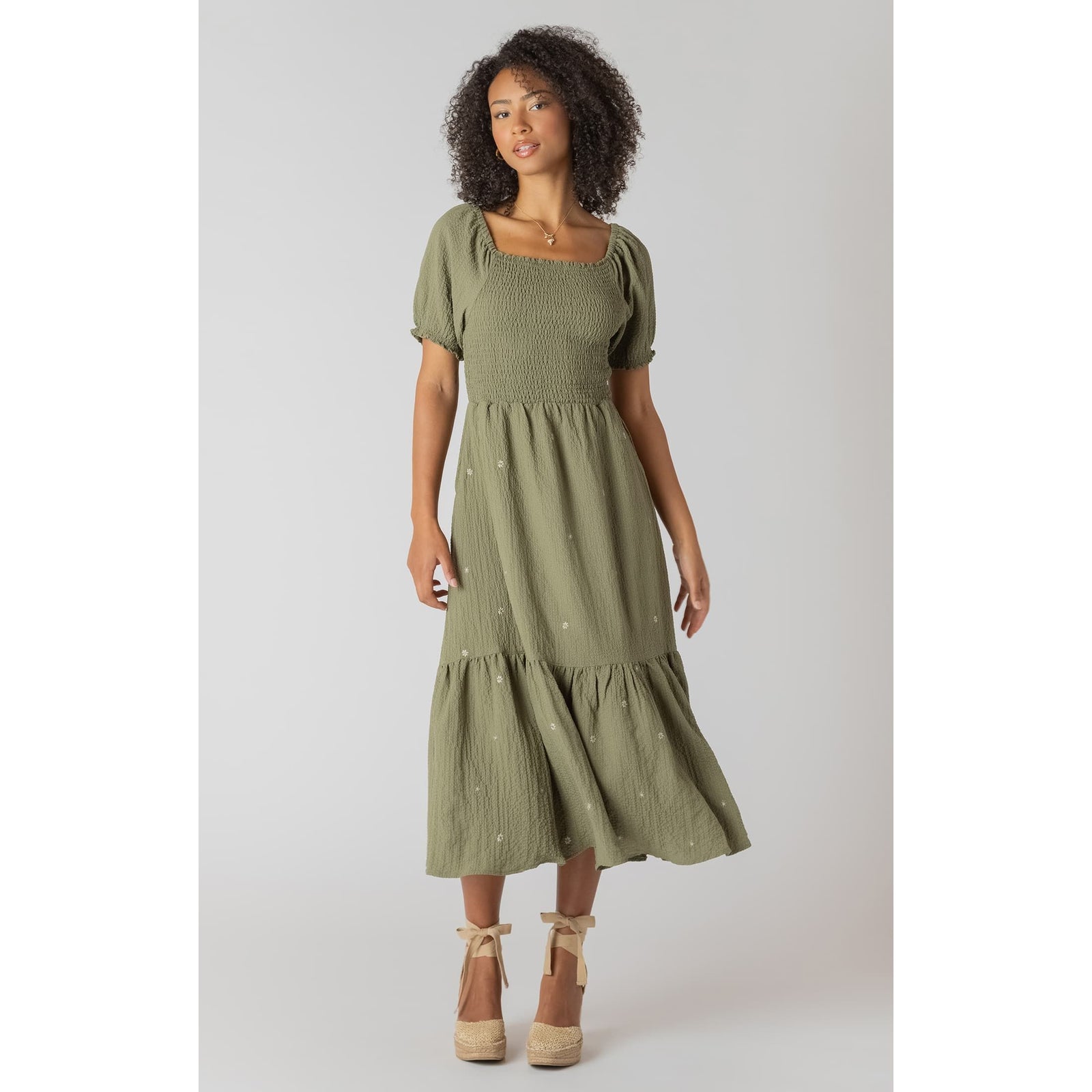 Olive green Room 34 Smocked Tiered Maxi Dress with a square-neck smocked bodice, puff sleeves, and embroidered flowers.